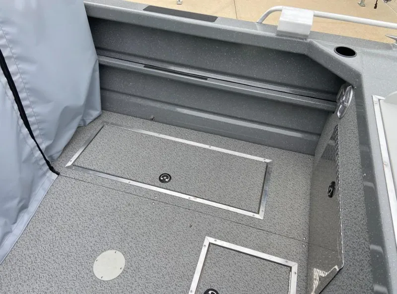 Slide: The Image of 2024 Spartan 200 Astoria boat interior with storage compartments. - 10