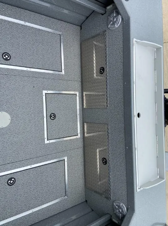 Slide: The Image of 2024 Spartan 200 Astoria boat interior with storage compartments. - 11