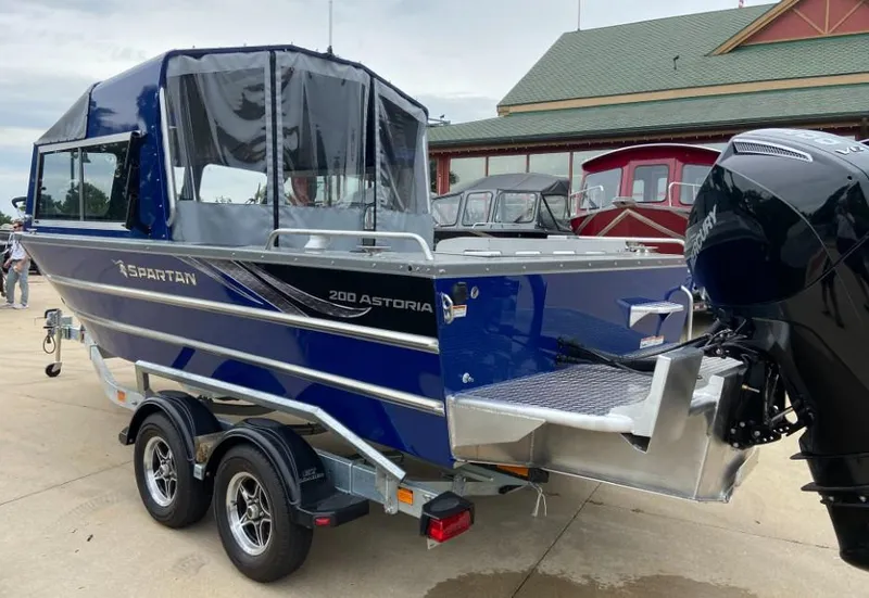 Slide: The Image of 2024 Spartan 200 Astoria boat on a trailer, rear view. - 2