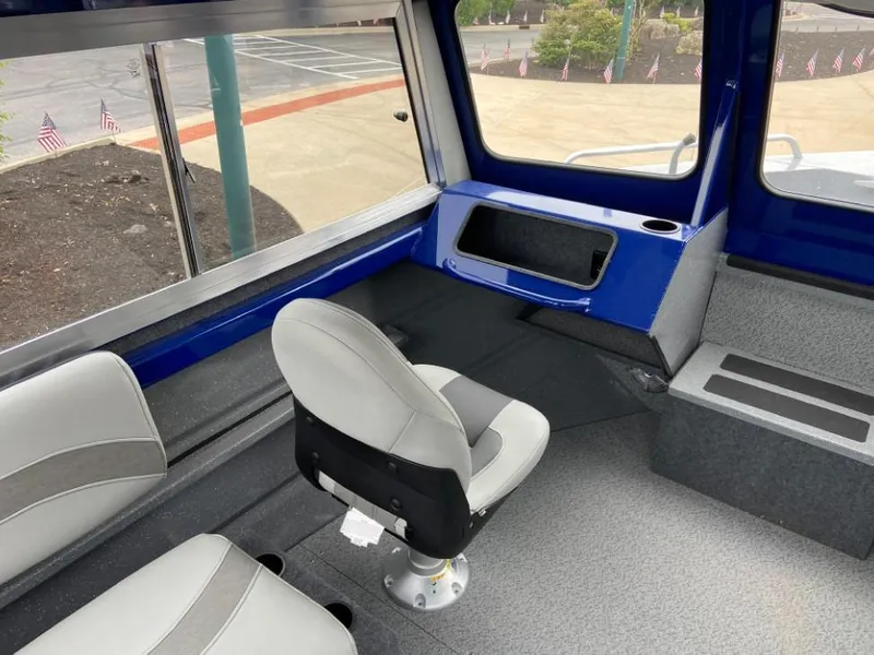 Slide: The Image of Interior of 2024 Spartan 200 Astoria boat with seating and storage compartments. - 6