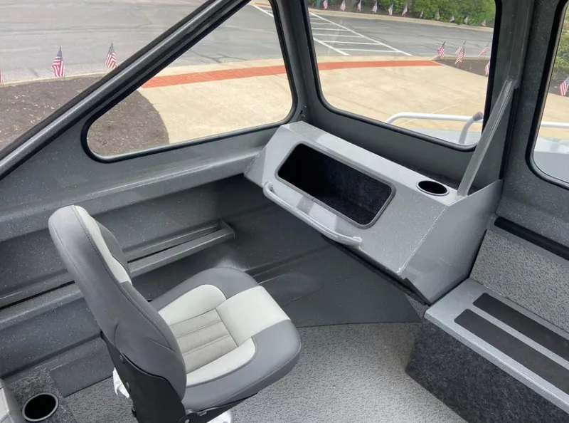Slide: The Image of Interior of 2024 Spartan 200 Astoria boat with seating and storage compartments. - 7
