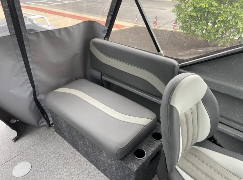 Slide: The Image of Interior seating of 2024 Spartan 200 Astoria boat with gray and white upholstery. - 8