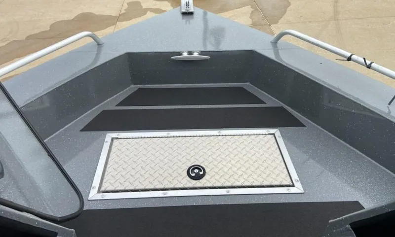 Slide: The Image of 2023 Spartan 215 Athens boat bow with storage compartment and non-slip flooring. - 11