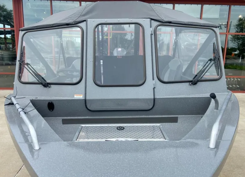 Slide: The Image of 2023 Spartan 215 Athens boat with windshield and canopy. - 3