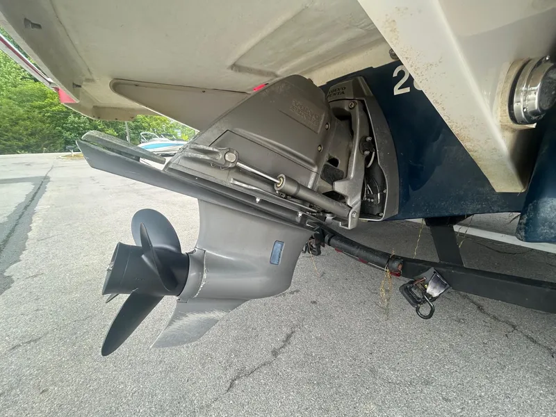 Slide: The Image of 2017 Four Winns H210 boat outboard motor and propeller on a trailer. - 10