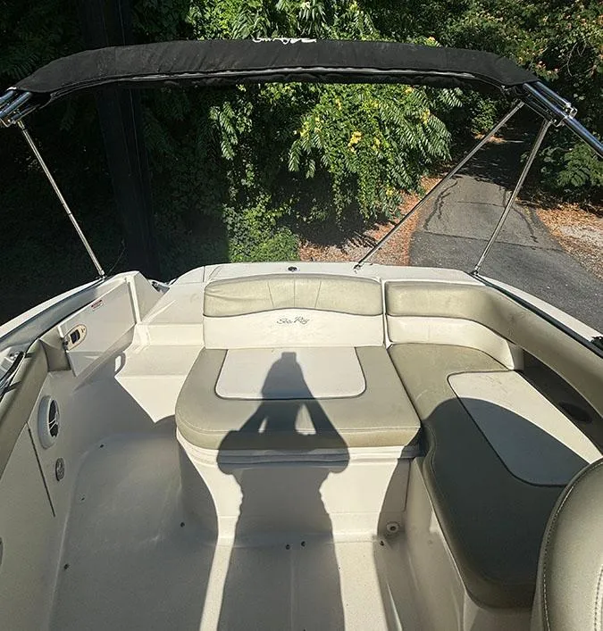 Slide: The Image of 2007 Sea Ray 220 Sundeck boat interior with seating and canopy. - 15