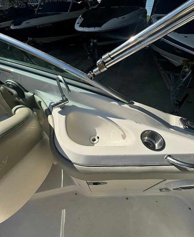 Slide: The Image of 2007 Sea Ray 220 Sundeck boat interior with sink and seating. - 16