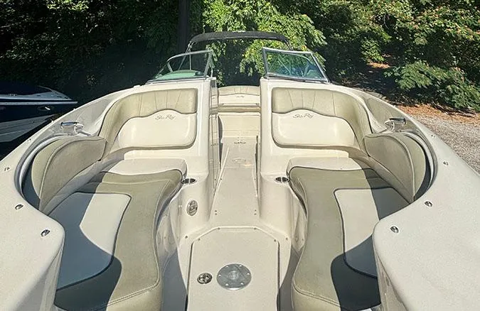 Slide: The Image of 2007 Sea Ray 220 Sundeck boat interior with cushioned seating and open deck. - 3