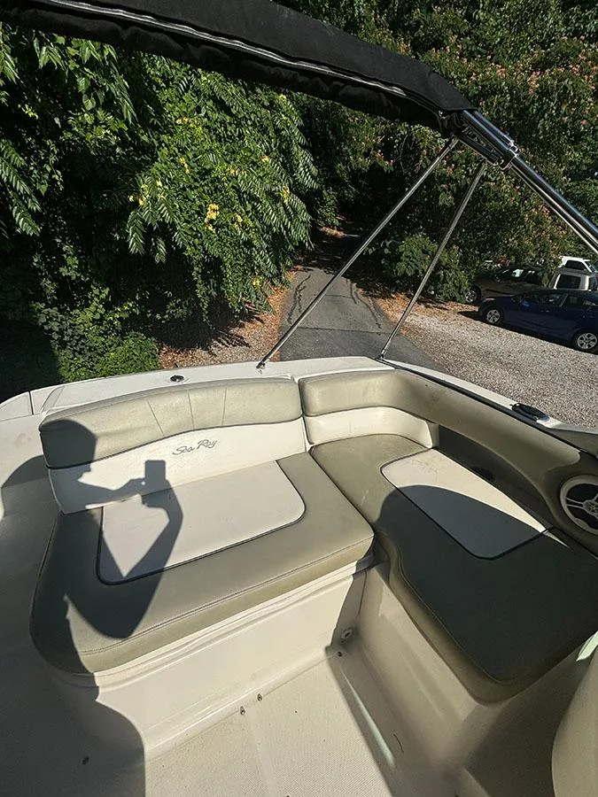 Slide: The Image of 2007 Sea Ray 220 Sundeck boat interior with cushioned seating. - 6