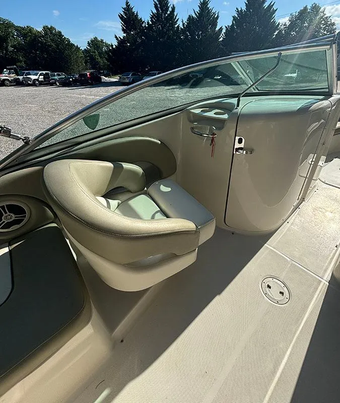 Slide: The Image of 2007 Sea Ray 220 Sundeck boat interior with seating and windshield. - 7