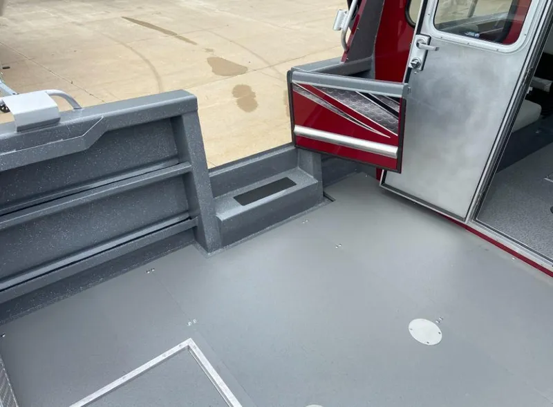 Slide: The Image of 2024 Spartan 240 MAXIMUS PRO XL boat deck and cabin entrance. - 10