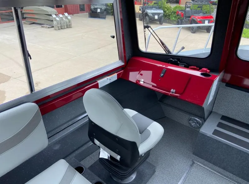 Slide: The Image of Interior of 2024 Spartan 240 MAXIMUS PRO XL boat with captain's chair and control panel. - 6