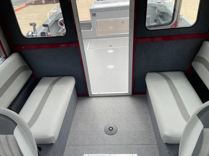 Slide: The Image of Interior of 2024 Spartan 240 MAXIMUS PRO XL boat with gray seating and carpet. - 8
