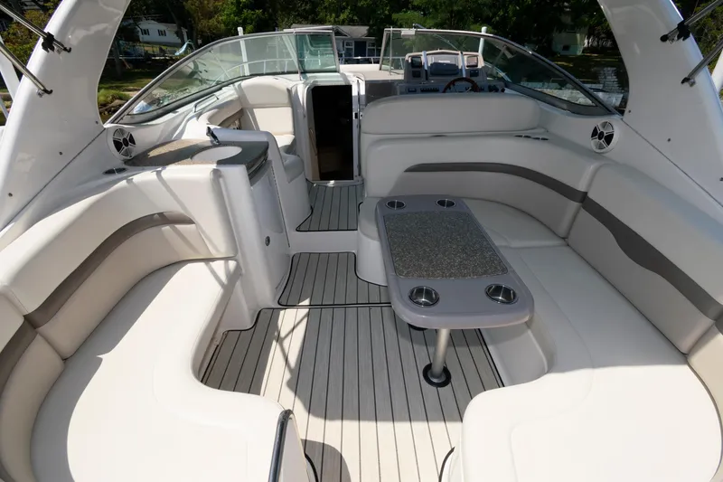 Slide: The Image of 2010 Chaparral Signature 350 boat interior with spacious seating and table. - 12