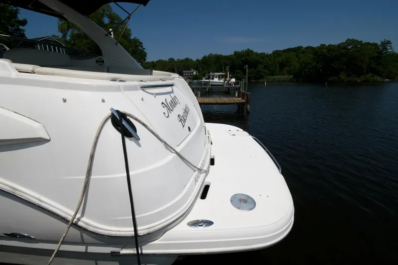 Slide: The Image of Chaparral Signature 350 2010 yacht docked by a serene lake. - 14