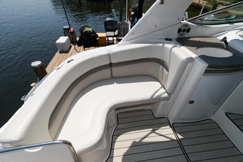 Slide: The Image of 2010 Chaparral Signature 350 boat with white leather seating and wooden deck. - 15