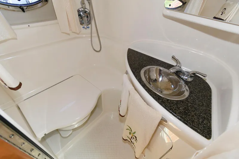 Slide: The Image of 2010 Chaparral Signature 350 bathroom with sink, toilet, and shower. - 22