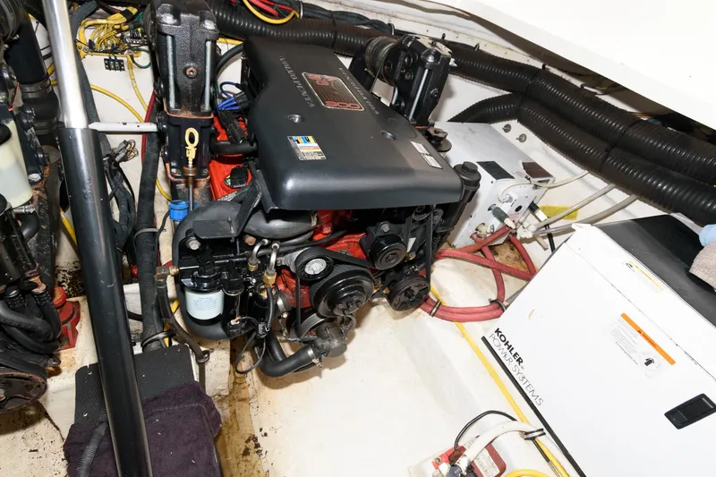 Slide: The Image of Engine compartment of a 2010 Chaparral Signature 350 boat with visible components and wiring. - 25