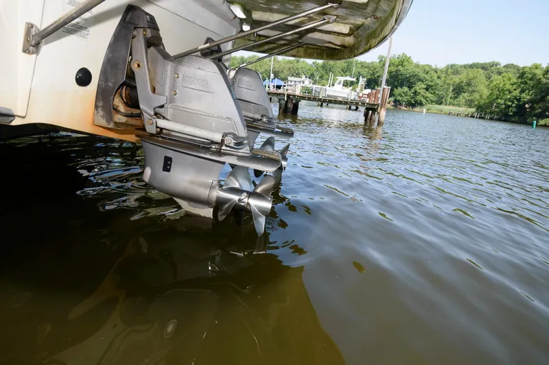 Slide: The Image of 2010 Chaparral Signature 350 boat propellers in water at a dock. - 27
