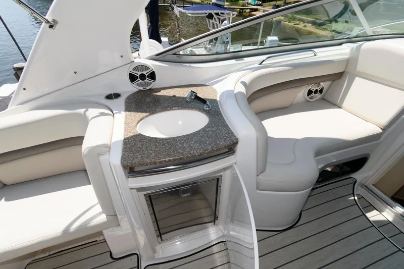Slide: The Image of 2010 Chaparral Signature 350 boat interior with sink and seating area. - 8