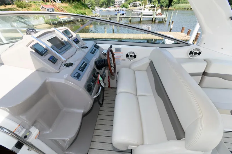 Slide: The Image of 2010 Chaparral Signature 350 boat cockpit with modern controls and comfortable seating. - 9
