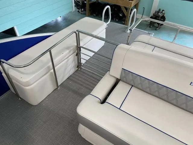 Slide: The Image of 2024 Bennington 25 QSB X1 boat dashboard with steering wheel and control panel. - 11