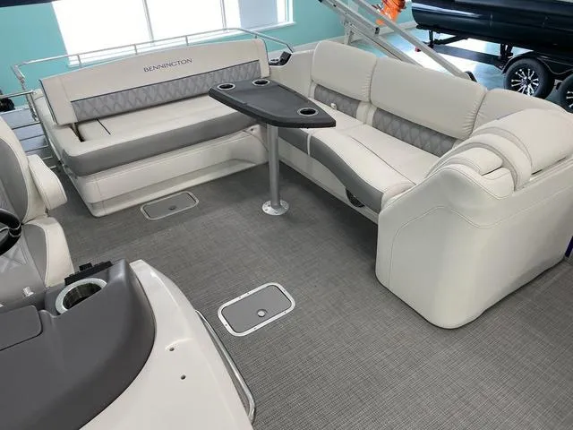 Slide: The Image of 2024 Bennington 25 QSB X1 boat helm with captain's chair and control panel. - 13