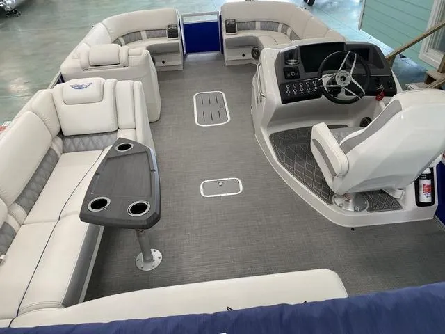 Slide: The Image of 2024 Bennington 25 QSB X1 boat interior with white and gray seating. - 14