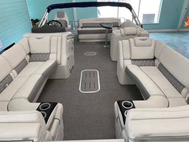 Slide: The Image of 2024 Bennington 25 QSB X1 pontoon boat interior with luxurious seating and modern design. - 19