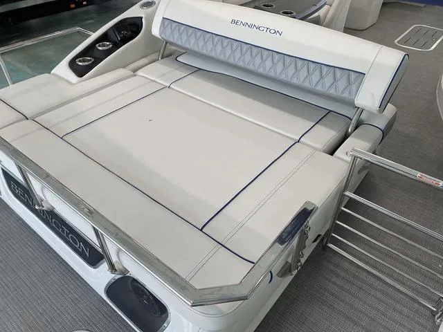 Slide: The Image of 2024 Bennington 25 QSB X1 pontoon boat interior with luxurious seating and modern design. - 8