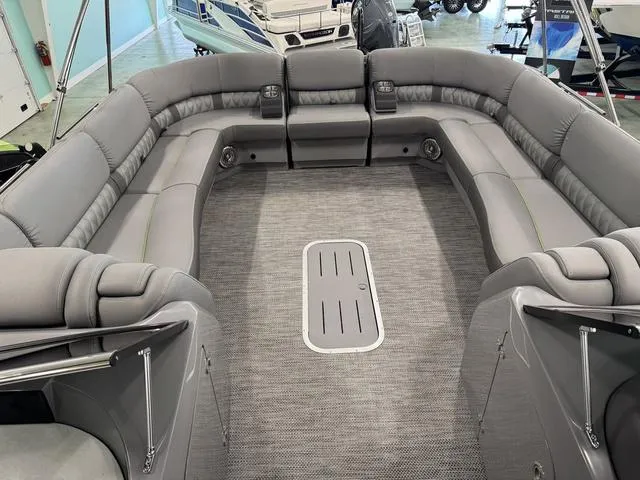 Slide: The Image of 2024 Bennington 28 QXSBWA X1 boat interior with luxurious seating and cup holders. - 10