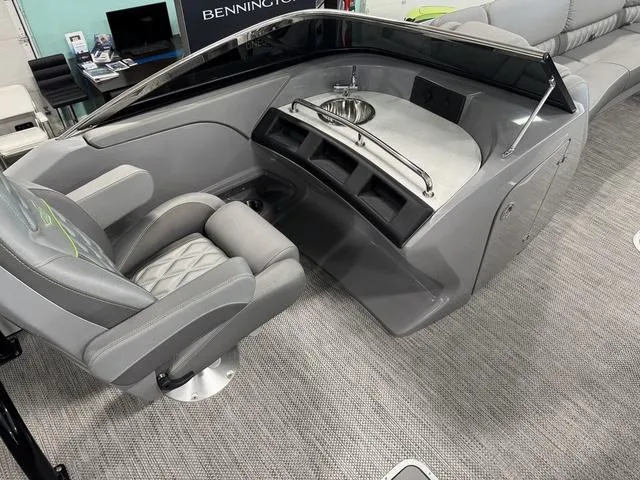 Slide: The Image of 2024 Bennington 28 QXSBWA X1 boat cockpit with steering wheel and control panel. - 16