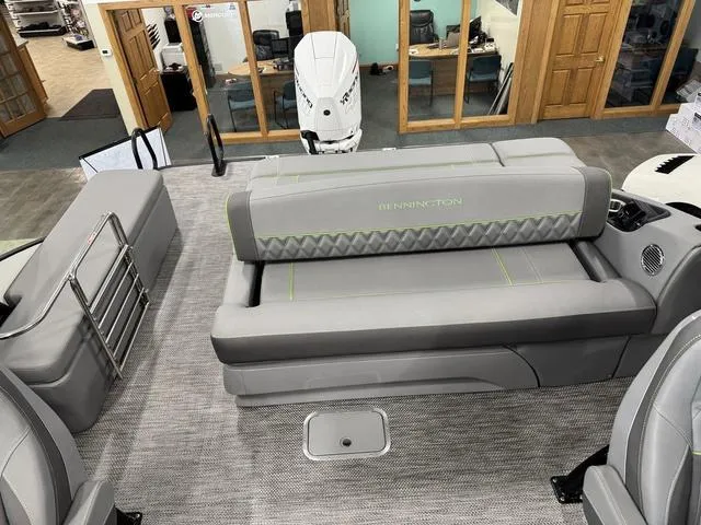 Slide: The Image of 2024 Bennington 28 QXSBWA X1 boat interior with captain's chair and control console. - 18
