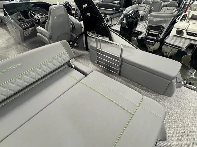 Slide: The Image of 2024 Bennington 28 QXSBWA X1 luxury pontoon boat interior with plush seating and modern helm. - 20