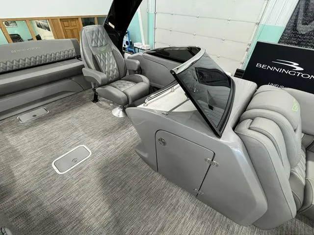 Slide: The Image of 2024 Bennington 28 QXSBWA X1 boat interior with luxurious seating and modern design. - 23