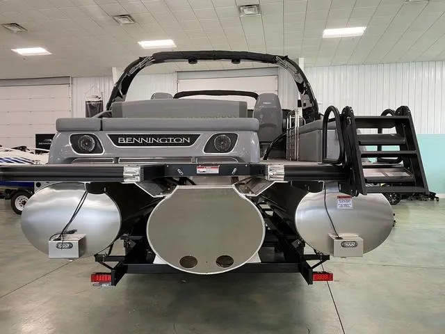 Slide: The Image of 2024 Bennington 28 QXSBWA X1 pontoon boat in a showroom. - 5