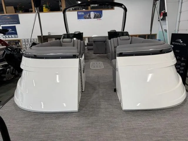 Slide: The Image of 2024 Bennington 28 QXSBWA X1 pontoon boat in a warehouse on a lift. - 7