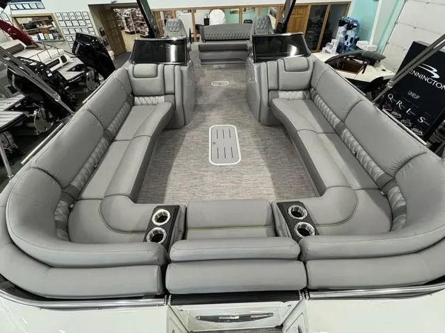 Slide: The Image of 2024 Bennington 28 QXSBWA X1 pontoon boat interior in a warehouse. - 8