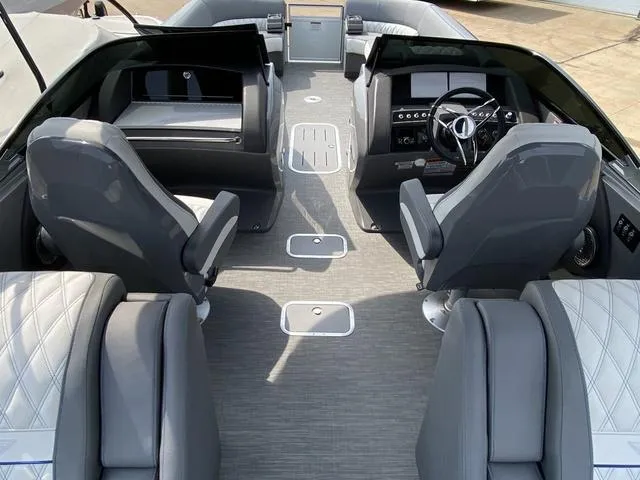 Slide: The Image of 2023 Bennington 27 RXFBWA T2 boat interior with modern seating and steering console. - 12