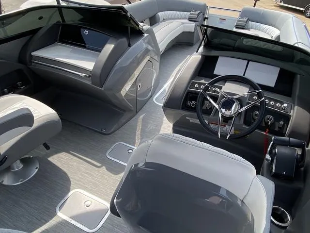 Slide: The Image of Interior of 2023 Bennington 27 RXFBWA T2 boat with modern seating and sleek dashboard design. - 14
