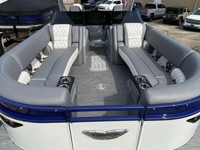 Slide: The Image of 2023 Bennington 27 RXFBWA T2 pontoon boat with luxurious seating and modern design. - 16
