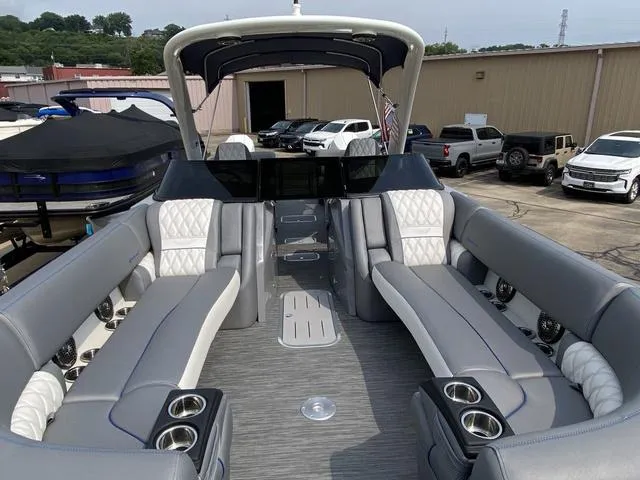 Slide: The Image of 2023 Bennington 27 RXFBWA T2 pontoon boat with luxurious seating and modern design. - 18