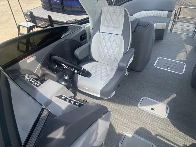 Slide: The Image of 2023 Bennington 27 RXFBWA T2 boat interior with modern helm and seating. - 6