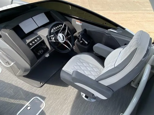 Slide: The Image of Captain's seat and helm of 2023 Bennington 27 RXFBWA T2 boat, featuring modern controls. - 9