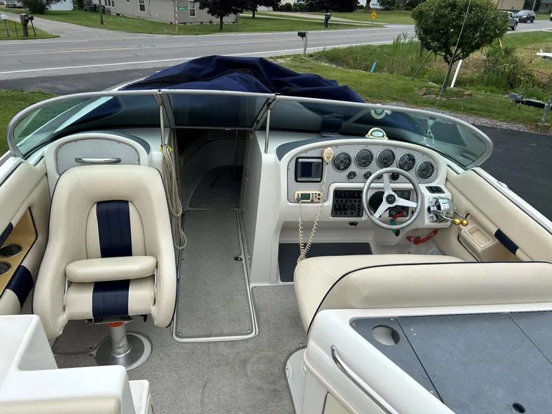 Slide: The Image of 2004 Chris-Craft Launch 28 boat interior with steering wheel and seating. - 6