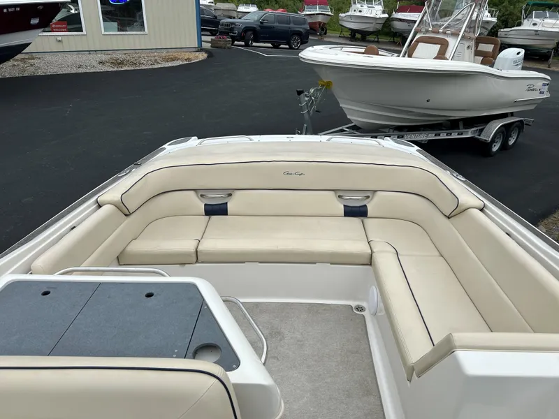 Slide: The Image of 2004 Chris-Craft Launch 28 boat with beige seating in a marina. - 7