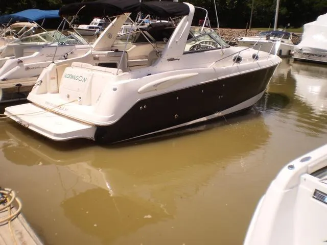 Slide: The Image of 2003 Monterey 302 boat docked in a marina. - 14