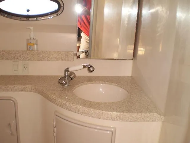 Slide: The Image of 2003 Monterey 302 boat bathroom with sink, mirror, and countertop. - 16