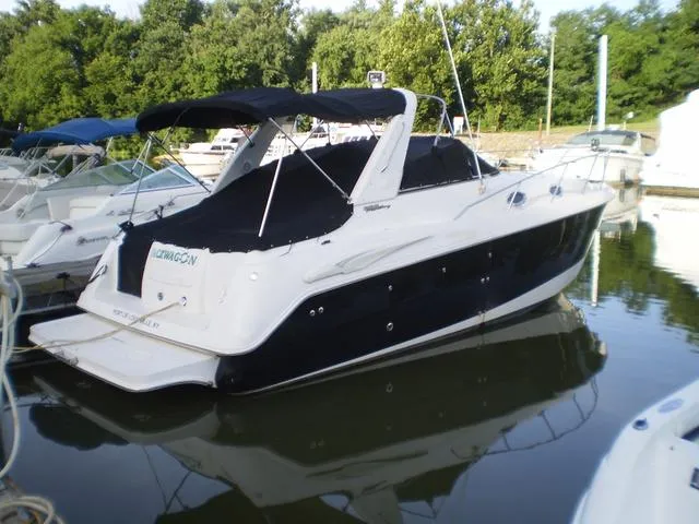 Slide: The Image of 2003 Monterey 302 boat docked in a marina. - 3