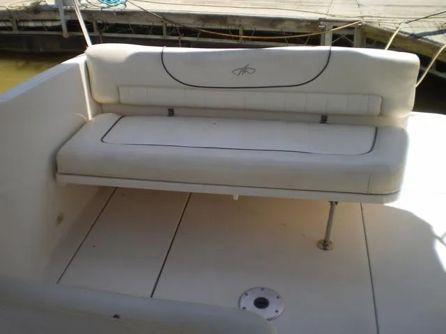 Slide: The Image of 2003 Monterey 302 boat interior with white cushioned seating. - 7